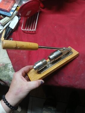 vintage Reed's Rocket nutcracker, featuring a metal cracking mechanism